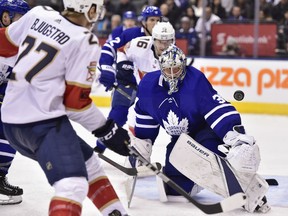 Maple Leafs goaltender Frederik Andersen watches the puck after making a save in front of the Florida Panthers' Nick Bjugstad during third period NHL action in Toronto on Wednesday night.