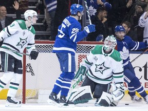 Dallas Stars goaltender Kari Lehtonen looks up at the Maple Leafs' James van Riemsdyk after he scored his hat trick goal during the third period of their game in Toronto on Wednesday night.