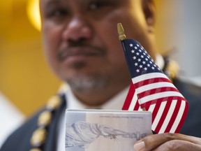In this undated image provided by nonprofit advocacy and legal group Equally American, John Fitisemanu, an American Samoan and the lead plaintiff in a lawsuit against the United States seeking full U.S. citizenship, poses for a photo in Salt Lake City, Utah. A lawsuit filed Tuesday, March 27, 2018, in federal court in Utah seeks to grant U.S. citizenship status to American Samoans. John Fitisemanu, and others who were born in American Samoa, are asking the court for citizenship under the 14th Amendment of the Constitution, which confers citizenship at birth to anyone born in the U.S.