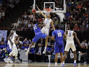 Kentucky forward Nick Richards (4) blocks a shot by Buffalo forward Nick Perkins (33) during the first half of a second-round game in the NCAA men's college basketball tournament Saturday, March 17, 2018, in Boise, Idaho.