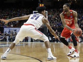 Ohio State forward Keita Bates-Diop, right, looks to pass around the defense of Gonzaga forward Rui Hachimura (21) during the first half of a second-round game in the NCAA men's college basketball tournament Saturday, March 17, 2018, in Boise, Idaho.