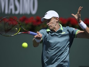 Kevin Anderson, of South Africa, returns a shots against Borna Coric, of Croatia, during the quarterfinals at the BNP Paribas Open tennis tournament, Thursday, March 15, 2018, in Indian Wells, Calif.