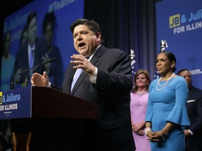 Democratic gubernatorial candidate J.B. Pritzker, left, addresses the crowd with lieutenant governor candidate Juliana Stratton after winning the Democratic gubernatorial primary over a field of five others, Tuesday, March 20, 2018, in Chicago.