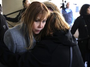In a Thursday, March 15, 2018 photo, Esperanza Perez, mother of Miguel Perez, an Army veteran who is facing deportation to Mexico, is comforted after receiving news that her son was denied U.S. citizenship. U.S. Immigration and Customs Enforcement officials confirmed Monday, Monday, March 26, 2018 that Miguel Perez has been deported to Mexico because of a 2008 drug-trafficking conviction.