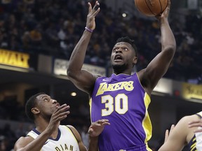 Los Angeles Lakers' Julius Randle shoots over Indiana Pacers' Thaddeus Young during the first half of an NBA basketball game, Monday, March 19, 2018, in Indianapolis.
