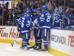 Toronto Maple Leafs' Nazem Kadri, centre, celebrates his goal against the Pittsburgh Penguins with centre Mitchell Marner (16) centre Tyler Bozak (42) and left wing James van Riemsdyk (25) during the second period of their NHL hockey game in Toronto on Saturday, March 10, 2018.