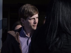 Edouard Maurice leaves court in Okotoks, Alta., Friday, March 9, 2018. Maurice faces three charges after police allege the rural homeowner confronted two people rummaging through his vehicles and shots were fired.