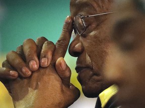 FILE - In this Thursday, Dec. 21, 2017, file photo of former South African Jacob Zuma, gestures as a new party leader addresses delegates during the closing of the ANC's elective conference in Johannesburg. The director of South Africa's National Prosecuting Authority says that former president Jacob Zuma will be prosecuted on 16 charges of corruption. Shaun Abrahams announced Friday that Zuma will be face charges including fraud, corruption, racketeering and money laundering.