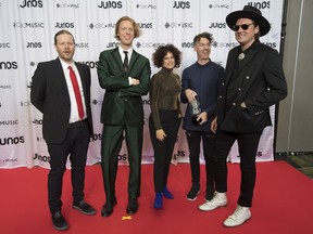 Members of Arcade Fire celebrate their Juno for International Achievement Award at the Juno Gala Dinner and Awards show in Vancouver, Saturday, March 24, 2018.