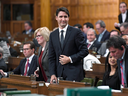 Prime Minister Justin Trudeau rises to vote during a marathon voting session in the House of Commons on Parliament Hill in Ottawa on Friday, March 23, 2018.