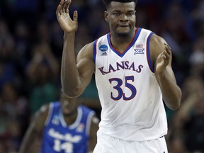 Kansas center Udoka Azubuike (35) celebrates after making a basket during the first half of an NCAA men's college basketball tournament second-round game against Seton Hall Saturday, March 17, 2018, in Wichita, Kan.