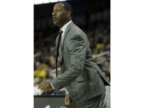 Montana head coach Travis DeCuire directs his team during the first half of an NCAA men's college basketball tournament first-round game against Michigan, Thursday, March 15, 2018, in Wichita, Kan.