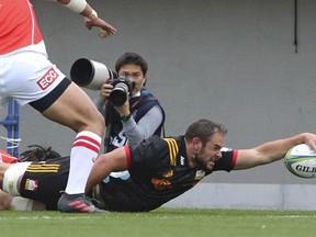 Tyler Ardron of New Zealand's Chiefs scores a try against the Japan's Sunwolves during their Super Rugby match in Tokyo, Saturday, March 24, 2018.