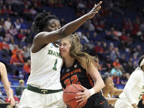 Oregon State's Kat Tudor (22) collides with Baylor's Dekeiya Cohen (1) during the first half of an NCAA women's college basketball tournament regional semifinal Friday, March 23, 2018, in Lexington, Ky.