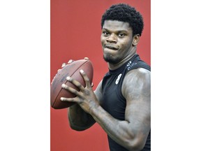 Lamar Jackson performs passing drills in front of NFL scouts during Louisville's football Pro Day, Thursday, March 29, 2018, in Louisville, Ky.