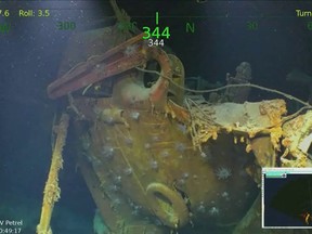 In this Monday, March 19, 2018, underwater video image courtesy of Paul Allen shows wreckage from the USS Juneau, a U.S. Navy ship sunk by the Japanese torpedoes 76 years ago, found in the South Pacific. Philanthropist and Microsoft co-founder Allen has announced that wreckage of the sunken ship on which five brothers died in World War II has been discovered in the South Pacific. A spokeswoman for Allen confirms wreckage from the USS Juneau was found Saturday, March 17, off the coast of the Solomon Islands. (Paul Allen via AP)