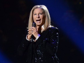FILE - In this Oct. 11, 2012, file photo, singer Barbra Streisand performs at the Barclays Center in the Brooklyn borough of New York. During a Friday, March 16, 2018 tribute to her decades of TV music specials and other programs, Streisand said she's never suffered sexual harassment but has felt abused by the media.