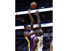 Los Angeles Lakers forward Julius Randle (30) shoots over New Orleans Pelicans center Emeka Okafor (50) in the first half of an NBA basketball game in New Orleans, Thursday, March 22, 2018.