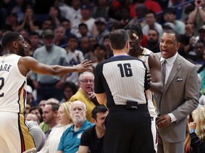 New Orleans Pelicans coach Alvin Gentry challenges an official on a foul call during the second half of an NBA basketball game against the Houston Rockets in New Orleans, Saturday, March 17, 2018. The Rockets won 107-101.