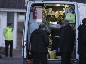 Police activity in Salisbury, England Wednesday March 7, 2018, around the home of former Russian double agent Sergei Skripal. The Russian ex-spy and his daughter are fighting for their lives in an English hospital after they were attacked Sunday with a nerve agent in a targeted murder attempt, British police said Wednesday. Sergei Skripal, 66, and his 33-year-old daughter Yulia were found unconscious on a bench in the southwest England city of Salisbury on Sunday.