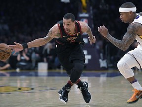 Cleveland Cavaliers guard George Hill, drives past Los Angeles Lakers guard Isaiah Thomas during the first half of an NBA basketball game, Sunday, March 11, 2018, in Los Angeles.