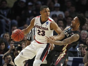 Gonzaga guard Zach Norvell Jr. (23) works against Florida State guard Braian Angola during the first half of an NCAA men's college basketball tournament regional semifinal Thursday, March 22, 2018, in Los Angeles.