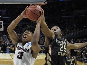 Florida State forward Mfiondu Kabengele (25) defends on a shot by Gonzaga forward Rui Hachimura (21) during the second half of an NCAA men's college basketball tournament regional semifinal Thursday, March 22, 2018, in Los Angeles.