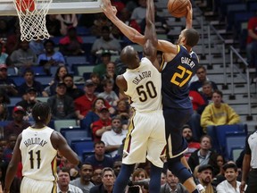 Utah Jazz center Rudy Gobert (27) shoots as New Orleans Pelicans center Emeka Okafor (50) defends the play in the first half of an NBA basketball game in New Orleans, Sunday, March 11, 2018.