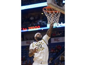 Indiana Pacers forward Trevor Booker dunks during the first half of the team's NBA basketball game against the New Orleans Pelicans in New Orleans on Wednesday, March 21, 2018.