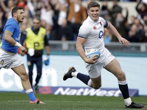 FILE - This is a Sunday, Feb. 4, 2018 file photo of  England's Owen Farrell, right, as he runs on to score a try during the Six Nations rugby union international match between Italy and England at the Olympic Stadium, in Rome, Italy.  Owen Farrell will captain England against France in Six Nations rugby on Saturday March 10, 2018, after regular skipper Dylan Hartley's tight calf failed to come right.