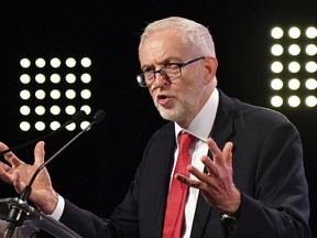 FILE - In this Thursday, Oct. 19, 2017 file photo, Britain's Labour Party leader Jeremy Corbyn delivers a speech prior to a meeting of European Socialists prior to an EU summit in Brussels. The United States and other allies have united behind the U.K. government in blaming Russia for the nerve-agent poisoning of former spy Sergei Skripal and his daughter Yulia. But Britain's main opposition party is split over how firmly to point the finger at Moscow.