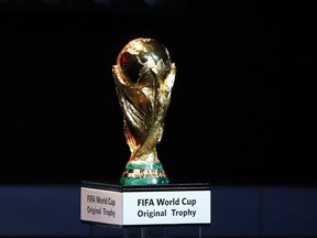 FILE - A Friday Dec. 1, 2017 file photo of the World Cup trophy placed on display during the 2018 soccer World Cup draw in the Kremlin in Moscow. Morocco has touted its limited threat from gun crime in a 2026 World Cup bidding proposal to take on the United States-led rival for the 2026 soccer showpiece. The North African nation highlights safety for visiting fans in bidding documents published by FIFA on Monday that do however show every stadium and training ground requires building work.