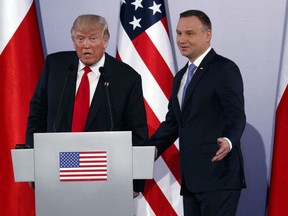 FILE - In this file photo dated Thursday July 6, 2017, Poland's President Andrzej Duda, right, and U.S President Donald Trump attend a news conference at Royal Castle, in Warsaw. According to online news reports published Tuesday March 6, 2018, the Polish President Andrzej Duda cannot count on any meetings with either President Donald Trump or Vice President Mike Pence until Poland changes their controversial new Holocaust law.