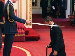Former Beatle  Ringo Starr, is made a knight by Britain's Prince William at Buckingham Palace during an Investiture ceremony in London Tuesday March 20, 2018.