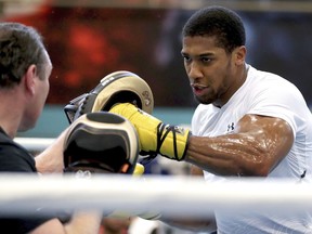 Britain's World Heavyweight Champion Anthony Joshua during the workout at the English Institute of Sport, Sheffield England Wednesday March 21, 2018. Joshua with fight New Zealand's Joseph Parker in a world title fight in Cardiff on March 31, 2018.