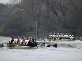 Oxford University Women's Boat Club, left, and Cambridge University Women's Boat Club in action during the Women's Boat Race on the River Thames, London, Saturday March 24, 2018.