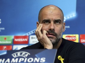 Manchester City soccer team manager Pep Guardiola reacts during the press conference in Manchester, England, Tuesday March 6, 2018. Manchester City play Basel in a Champions League clash upcoming Wednesday.