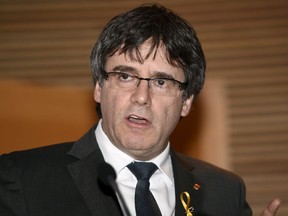 Deposed leader of Catalonia's pro-independence party Carles Puigdemont speaks at a press conference in Finnish Parliament in Helsinki, Finland on Thursday March 22, 2018.
