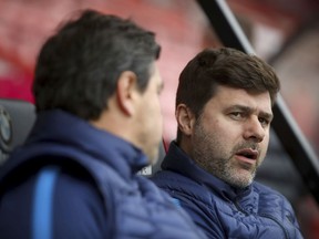 Tottenham Hotspur manager Mauricio Pochettino looks on ahead of their match against AFC Bournemouth during their English Premier League soccer match at the Vitality Stadium in Bournemouth, Sunday March 11, 2018.