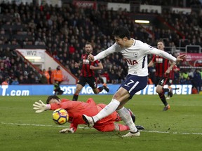 Tottenham Hotspur's Son Heung-Min scores his side's third goal of the game against AFC Bournemouth during their English Premier League soccer match at the Vitality Stadium in Bournemouth, Sunday March 11, 2018.