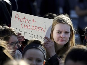 In this Feb. 28, 2018 photo, Somerville High School junior Megan Barnes marches with others during a student walkout at the school in Somerville, Mass. A large-scale, coordinated demonstration is planned for Wednesday, March 14, when organizers have called for a 17-minute school walkout nationwide to protest gun violence.
