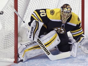 Boston Bruins goaltender Tuukka Rask (40) gets beat for a goal by Columbus Blue Jackets center Boone Jenner during the first period of an NHL hockey game in Boston, Monday, March 19, 2018.