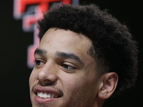 Texas Tech forward Zach Smith smiles during a news conference at the NCAA men's college basketball tournament, Saturday, March 24, 2018, in Boston. Texas Tech faces Villanova in a regional final on Sunday.