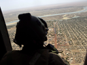 A French soldier stands inside a military helicopter flying over Mali in 2017. Canada's contribution to the UN peacekeeping mission in Mali is expected to include up to six helicopters.