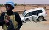 A peacekeeper guards a UN vehicle that ran over an IED near Kidal, Mali, in July 2016. The Mali mission has been the UN’s bloodiest to date.