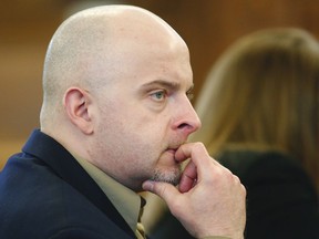 FILE - In this March 6, 2018 file photo, Radoslaw Czerkawski listens to jury selection for his trial on animal cruelty charges at Norfolk Superior Court on in Dedham, Mass. Czerkawski was found guilty on Monday, March 26 of numerous animal cruelty charges.