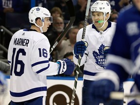 Toronto Maple Leafs forward James van Riemsdyk celebrates his goal against the Tampa Bay Lightning with Mitch Marner on March 20.