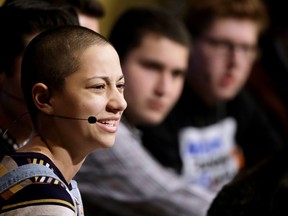 Marjory Stoneman Douglas High School students, front the left, Emma Gonzalez, Alex Wind, and Matt Deitsch participate in a panel discussion about guns, Tuesday, March 20, 2018, at Harvard Kennedy School's Institute of Politics, in Cambridge, Mass. The Feb. 14, 2018 attack in Florida killed 17 people, 14 of them students. The students have become vocal advocates for stricter gun laws.