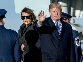 President Donald Trump, accompanied by first lady Melania Trump, waves to members of the media as they arrive at Andrews Air Force Base, Md., Saturday, March 3, 2018 to board Marine One for a short trip to the White House.