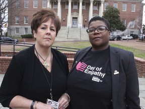 In this March 3, 2018 photo, Kimberly Haven, left, and Monica Cooper, two advocates for reforms in correctional facilities, pose for a photo in front of the Maryland State House in Annapolis, Md. Both Haven and Cooper, who are former inmates, testified in favor of a measure to ensure women have free access to menstrual products on request while in correctional facilities. Growing recognition about the lack of access to basic feminine hygiene products that can occur in correctional facilities has created a wave of measures in state legislatures.
